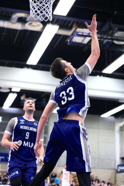 Game action with Ryan Mikesell 33 MLP Academics Heidelberg and Paul Zipser 9 MLP Academics Heidelberg Basketball Champions League MLP Academics Heidelberg - ERA Basketball Nymburk Ryan Mikesell 33 MLP Academics Heidelberg with a shot Copyright: xspeedshotx