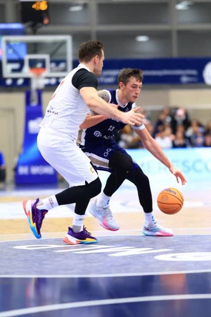 Scene with Ryan Mikesell 33 MLP Academics Heidelberg in a duel on the court Basketball Champions League MLP Academics Heidelberg - ERA Basketball Nymburk Ryan Mikesell 33 MLP Academics Heidelberg in a duel Copyright: xspeedshotx