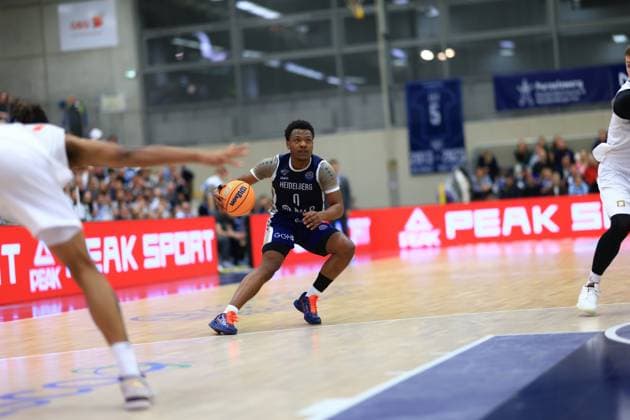 Game action with DJ Horne 0 MLP Academics Heidelberg dribbling on the court Basketball Champions League MLP Academics Heidelberg - ERA Basketball Nymburk DJ Horne 0 MLP Academics Heidelberg with ball in action Copyright: xspeedshotx