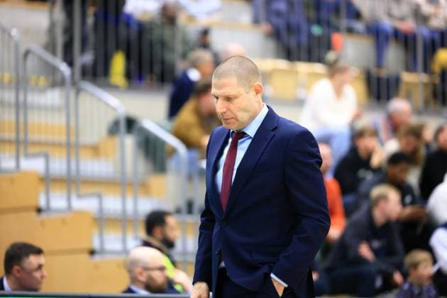 Official in blue suit on the sidelines Basketball Champions League MLP Academics Heidelberg - ERA Basketball Nymburk Official on the sidelines Copyright: xspeedshotx