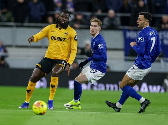 7th January 2026; Hill Dickinson Stadium, Liverpool, England; Premier League Football, Everton versus Wolverhampton Wanderers; Tolu Arokodare of Wolverhampton Wanderers plays watched by James Garner and Dwight McNeil of Everton FC  RogerxEvans Content restricted for UK based newspaper