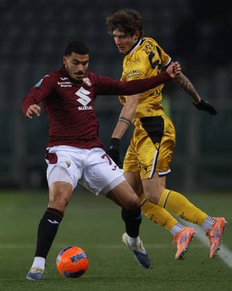 Turin, Italy, 7th January 2026. Alessandro Zanoli of Udinese Calcio clashes with Zakaria Aboukhlal of Torino FC during the Torino vs Udinese Serie A match at Stadio Grande Torino, Turin. Picture credit should read: Jonathan Moscrop Sportimage EDITORIAL USE ONLY. No use with unauthorised audio, video, data, fixture lists, club league logos or live services. Online in-match use limited to 120 images, no video emulation. No use in betting, games or single club league player publications. SPI_008_JM_TORO_UDINESE_ SPI-4408-0008
