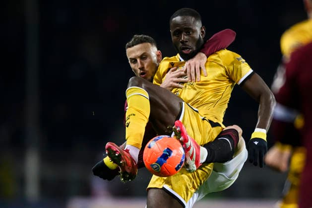 Torino FC v Udinese Calcio - Serie A Keinan Davis of Udinese Calcio competes for the ball with Ardian Ismajli of Torino FC during the Serie A football match between Torino FC and Udinese Calcio. Turin Italy Copyright: xNicolòxCampox