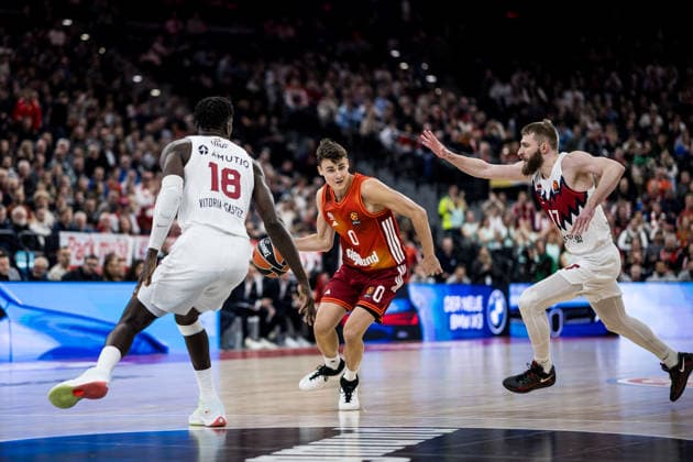 MUNICH, GERMANY - JANUARY 07: Neno Dimitrijevic (FC Bayern Muenchen, 0) controls the ball against Khalifa Diop (Kosner Baskonia Vitoria-Gasteiz, 18) and Gytis Radzevicius (Kosner Baskonia Vitoria-Gasteiz, 17) during the Turkish Airlines EuroLeague match between FC Bayern Muenchen vs. Kosner Baskonia Vitoria-Gasteiz at SAP Garden on round 20 of Turkish Airlines EuroLeague on January 07, 2026 in Munich, Germany. Bavaria Germany Copyright: xSteffiexWunderlx