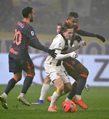 (260108) -- PARMA, Jan. 8, 2026 -- Inter Milan s Hakan Calhanoglu (L) and Manuel Akanji (R) vie with Parma s Jakob Ondrejka during a Serie A football match between Parma and Inter Milan in Parma, Italy, Jan. 7, 2026. (Photo by Xinhua) (SP)ITALY-PARMA-FOOTBALL-SERIE A-PARMA VS INTER MILAN AlbertoxLingria 