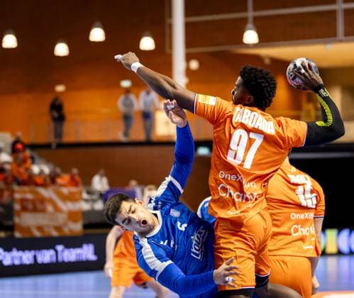 ALMERE - Reinier Taboada of the Netherlands in action against Dimitrios Panagiotou of Greece during the Netherlands-Greece Golden League handball match. The handball players are preparing for the European Championship, EM, Europameisterschaft SEM VAN DER WAL ANP xVIxANPxSportx xxANPxIVx 546718486 originalFilename: 546718486.jpg