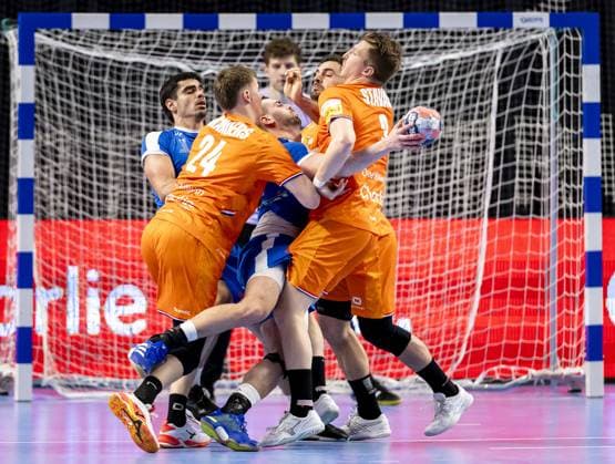 ALMERE - Greece s Theodoros Boskos is pinned down by the Netherlands Driek Manders and the Netherlands Ivar Stavast during the Dutch Golden League handball match. The handball players are preparing for the European Championship, EM, Europameisterschaft SEM VAN DER WAL ANP xVIxANPxSportx xxANPxIVx 546718662 originalFilename: 546718662.jpg