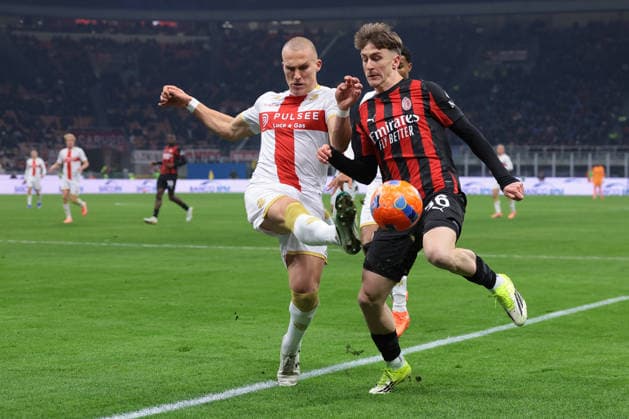 Milan, Italy, 8th January 2026. Leo Ostigard of Genoa CFC challenges Alexis Saelemaekers of AC Milan the AC Milan vs Genoa Serie A match at Giuseppe Meazza, Milan. Picture credit should read: Jonathan Moscrop Sportimage EDITORIAL USE ONLY. No use with unauthorised audio, video, data, fixture lists, club league logos or live services. Online in-match use limited to 120 images, no video emulation. No use in betting, games or single club league player publications. SPI_013_JM_MILAN_GENOA_ SPI-4409-0014