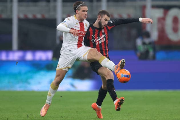 Milan, Italy, 8th January 2026. Lorenzo Colombo of Genoa CFC challenges Strahinja Pavlovic of AC Milan during the AC Milan vs Genoa Serie A match at Giuseppe Meazza, Milan. Picture credit should read: Jonathan Moscrop Sportimage EDITORIAL USE ONLY. No use with unauthorised audio, video, data, fixture lists, club league logos or live services. Online in-match use limited to 120 images, no video emulation. No use in betting, games or single club league player publications. SPI_035_JM_MILAN_GENOA_ SPI-4409-0035