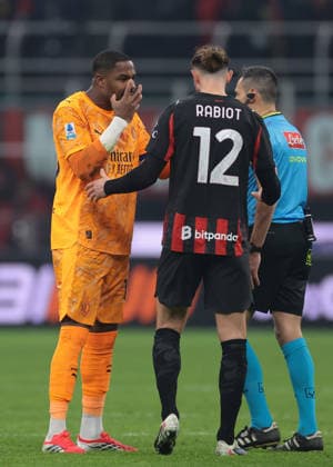 Milan, Italy, 8th January 2026. Adrien Rabiot and Mike Maignan of AC Milan discuss with the Referee Maurizio Mariani following the final whistle of the AC Milan vs Genoa Serie A match at Giuseppe Meazza, Milan. Picture credit should read: Jonathan Moscrop Sportimage EDITORIAL USE ONLY. No use with unauthorised audio, video, data, fixture lists, club league logos or live services. Online in-match use limited to 120 images, no video emulation. No use in betting, games or single club league player publications. SPI_069_JM_MILAN_GENOA_ SPI-4409-0069
