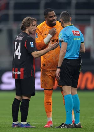 Milan, Italy, 8th January 2026. Luka Modric of AC Milan offers to shakes hands as team mate Mike Maignan discusses with the Referee Maurizio Mariani following the final whistle of the AC Milan vs Genoa Serie A match at Giuseppe Meazza, Milan. Picture credit should read: Jonathan Moscrop Sportimage EDITORIAL USE ONLY. No use with unauthorised audio, video, data, fixture lists, club league logos or live services. Online in-match use limited to 120 images, no video emulation. No use in betting, games or single club league player publications. SPI_089_JM_MILAN_GENOA_ SPI-4409-0089