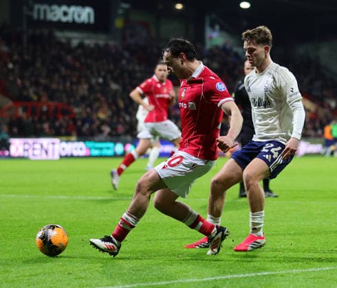 9th January 2026; Racecourse Ground, Wrexham, Wales; FA Cup Football, Wrexham versus Nottingham Forest; Ollie Rathbone of Wrexham AFC tracked by James McAtee of Nottingham Forest  RogerxEvans