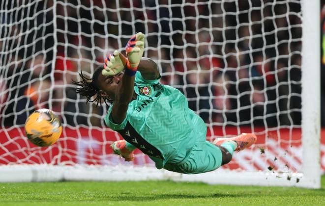 Arthur Okonkwo of Wrexham saves a penalty in the shootout Wrexham v Nottingham Forest, Emirates FA Cup, Third Round, Football, SToK Cae Ras, Wrexham, UK - 09 Jan 2026Wrexham SToK Cae Ras United Kingdom EDITORIAL USE ONLY No use with unauthorised audio, video, data, fixture lists, club league logos or live services. Online in-match use limited to 120 images, no video emulation. No use in betting, games or single club league player publications. Copyright: xKieranxMcManus Shutterstockx 16233000br
