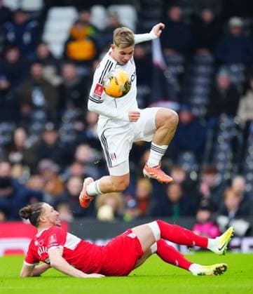 Emile Smith Rowe of Fulham hurdles over a challenge from Luke Ayling of Middlesbrough Fulham v Middlesbrough, Emirates FA Cup, Third Round, Football, Craven Cottage, London, UK - 10 Jan 2026London Craven Cottage United Kingdom EDITORIAL USE ONLY No use with unauthorised audio, video, data, fixture lists, club league logos or live services. Online in-match use limited to 120 images, no video emulation. No use in betting, games or single club league player publications. Copyright: xJavierxGarcia Shutterstockx 16246253y