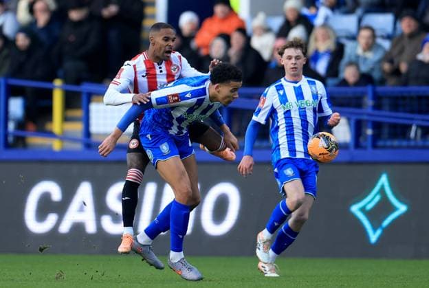 Rico Henry of Brentford in action against Gabriel Otegbayo of Sheffield Wednesday Sheffield Wednesday v Brentford, Emirates FA Cup, Third Round, Football, Hillsborough, Sheffield, UK - 10 Jan 2026Sheffield Hillsborough United Kingdom EDITORIAL USE ONLY No use with unauthorised audio, video, data, fixture lists, club league logos or live services. Online in-match use limited to 120 images, no video emulation. No use in betting, games or single club league player publications. Copyright: xGeorgexTewkesbury Shutterstockx 16246263as