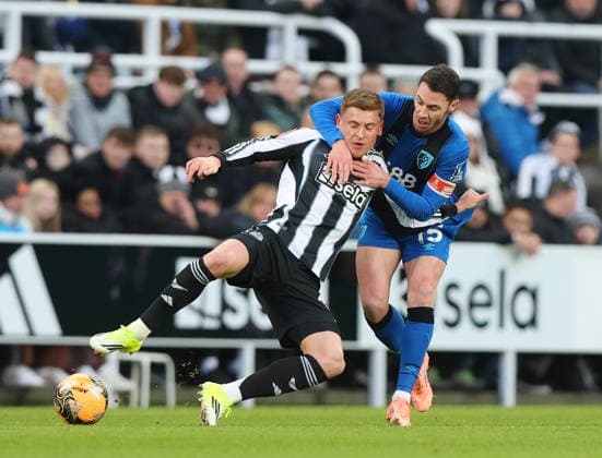 Newcastle Upon Tyne, England, 10th January 2026. Harvey Barnes of Newcastle United tussles with Adam Smith of Bournemouth during the Newcastle United vs AFC Bournemouth FA Cup match at St. James Park, Newcastle Upon Tyne. Picture credit should read: Nigel Roddis Sportimage EDITORIAL USE ONLY. No use with unauthorised audio, video, data, fixture lists, club league logos or live services. Online in-match use limited to 120 images, no video emulation. No use in betting, games or single club league player publications. SPI_021_NR_NEWC_BOUR SPI-4441-0021
