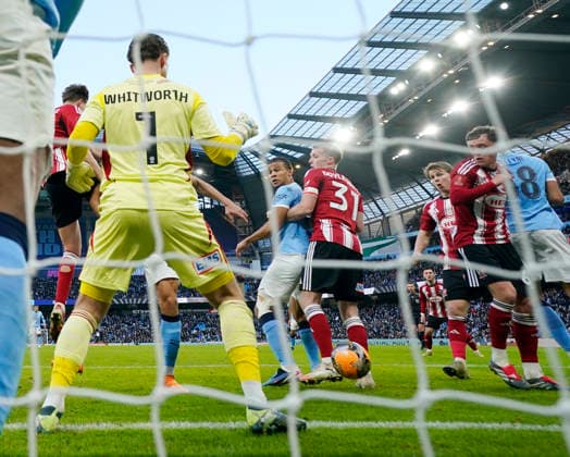 Manchester, England, 10th January 2026. Nathan Ake of Manchester City and Jake Doyle-Hayes of Exeter City tussle for the ball and it goes into the net for the third goal during the Manchester City vs Exeter City FA Cup match at the Etihad Stadium, Manchester. Picture credit should read: Andrew Yates Sportimage EDITORIAL USE ONLY. No use with unauthorised audio, video, data, fixture lists, club league logos or live services. Online in-match use limited to 120 images, no video emulation. No use in betting, games or single club league player publications. SPI_047_AY_Man_City_Exeter SPI-4442-0046