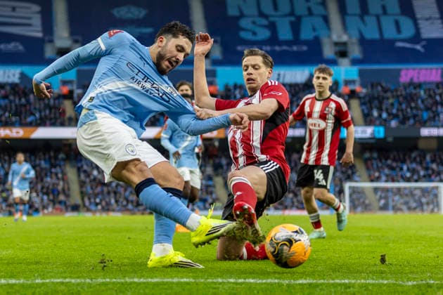 10th January 2026; Etihad Stadium, Manchester, Lancashire, England; FA Cup Football, Manchester City versus Exeter City; Rayan Cherki of Manchester City under pressure from Jack Fitzwater of Exeter City  TimxWilliams