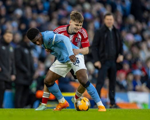 10th January 2026; Etihad Stadium, Manchester, Lancashire, England; FA Cup Football, Manchester City versus Exeter City; Ryan McAidoo of Manchester City under pressure  TimxWilliams