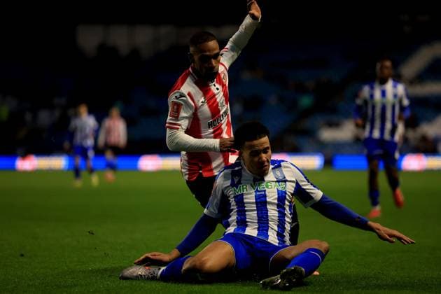 Rico Henry of Brentford in action against Gabriel Otegbayo of Sheffield Wednesday Sheffield Wednesday v Brentford, Emirates FA Cup, Third Round, Football, Hillsborough, Sheffield, UK - 10 Jan 2026Sheffield Hillsborough United Kingdom EDITORIAL USE ONLY No use with unauthorised audio, video, data, fixture lists, club league logos or live services. Online in-match use limited to 120 images, no video emulation. No use in betting, games or single club league player publications. Copyright: xGeorgexTewkesbury Shutterstockx 16246263by