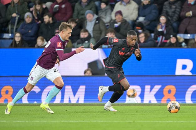 10th January 2026; Turf Moor, Burnley, Lancashire, England; FA Cup Football, Burnley versus Millwall; Oliver Sonne of Burnley pursues Aidomo Emakhu of Millwall down the wing  LeexDurkin