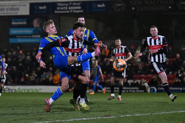 Will Dawes of Weston-super-Mare battles with Reece Staunton of Grimsby Town Grimsby Town v Weston Super Mare, Emirates FA Cup, Third Round, Football, Blundell Park, Grimsby, UK - 10 Jan 2026Grimsby Blundell Park United Kingdom EDITORIAL USE ONLY No use with unauthorised audio, video, data, fixture lists, club league logos or live services. Online in-match use limited to 120 images, no video emulation. No use in betting, games or single club league player publications. Copyright: xAnnaxGowthorpe Shutterstockx 16246310s