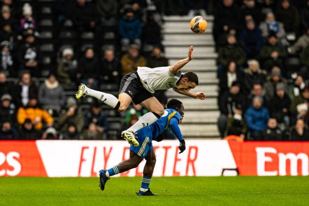 11th January 2026; Pride Park, Derby, Derbyshire, England; FA Cup Football, Derby County versus Leeds United; Craig Forsyth of Derby County collides with Wilfried Gnonto of Leeds United  GodfreyxPitt Content restricted for UK based newspaper