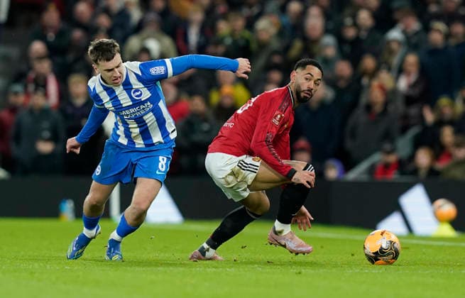 Manchester, England, 11th January 2026. Matheus Cunha of Manchester United, ManU (R) is challenged by Brajan Gruda of Brighton during the Manchester United vs Brighton and Hove Albion FA Cup match at Old Trafford, Manchester. Picture credit should read: Andrew Yates Sportimage EDITORIAL USE ONLY. No use with unauthorised audio, video, data, fixture lists, club league logos or live services. Online in-match use limited to 120 images, no video emulation. No use in betting, games or single club league player publications. SPI_029_AY_MAN_UTD_BRIGHTON SPI-4446-0029