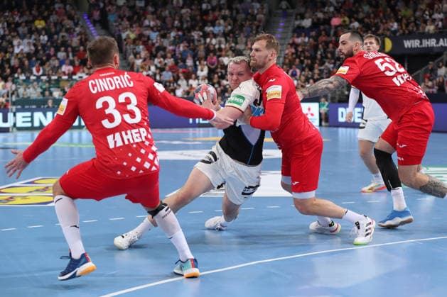 11 01 2026, xgox, handball, international match, Germany Croatia v l Justus Fischer Germany, 54 , David Mandic Croatia, 39 duel, duel, fight, tackle Hannover