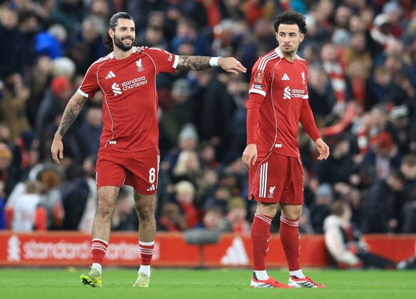 Liverpool, England, 12th January 2026. Dominik Szoboszlai (L) of Liverpool celebrates with Curtis Jones after scoring to make it 1-0 during the Liverpool vs Barnsley FA Cup match at Anfield, Liverpool. Picture credit should read: Jessica Hornby Sportimage EDITORIAL USE ONLY. No use with unauthorised audio, video, data, fixture lists, club league logos or live services. Online in-match use limited to 120 images, no video emulation. No use in betting, games or single club league player publications. SPI_052_JH_Liverpool_Barnsley SPI-4444-0052