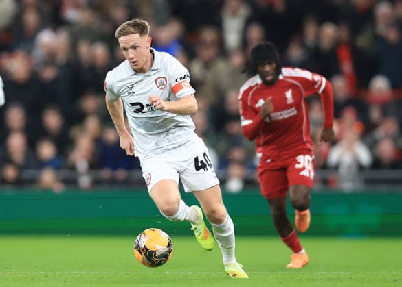 Liverpool, England, 12th January 2026. Davis Keillor-Dunn of Barnsley with the ball during the Liverpool vs Barnsley FA Cup match at Anfield, Liverpool. Picture credit should read: Jessica Hornby Sportimage EDITORIAL USE ONLY. No use with unauthorised audio, video, data, fixture lists, club league logos or live services. Online in-match use limited to 120 images, no video emulation. No use in betting, games or single club league player publications. SPI_056_JH_Liverpool_Barnsley SPI-4444-0056