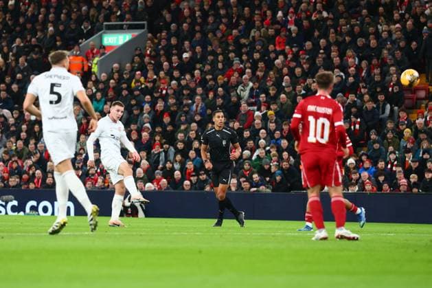 Giorgi Mamardashvili of Liverpool saves a shot from Jonathan Bland of Barnsley Liverpool v Barnsley, Emirates FA Cup, Third Round, Football, Anfield, Liverpool, UK - 12 Jan 2026Liverpool Anfield United Kingdom EDITORIAL USE ONLY No use with unauthorised audio, video, data, fixture lists, club league logos or live services. Online in-match use limited to 120 images, no video emulation. No use in betting, games or single club league player publications.  Copyright: xPaulxCurrie Shutterstockx 16246339an