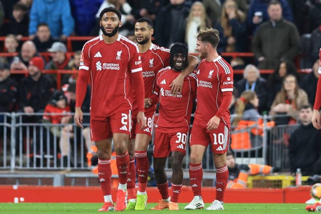 Liverpool, England, 12th January 2026. Jeremie Frimpong (2nd R) of Liverpool celebrates after scoring to make it 2-0 during the Liverpool vs Barnsley FA Cup match at Anfield, Liverpool. Picture credit should read: Jessica Hornby Sportimage EDITORIAL USE ONLY. No use with unauthorised audio, video, data, fixture lists, club league logos or live services. Online in-match use limited to 120 images, no video emulation. No use in betting, games or single club league player publications. SPI_066_JH_Liverpool_Barnsley SPI-4444-0066