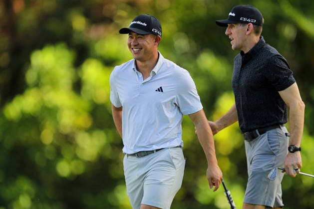 January 12, 2026 - Collin Morikawa chats with his caddie Mark Urbanek during a Practice Round prior to the 2026 Sony Open in Hawaii at Waialae Country Club in Honolulu, HI - CSM Honolulu USA - ZUMAc04_ 20260112_zma_c04_026 Copyright: xAndrewxLeex