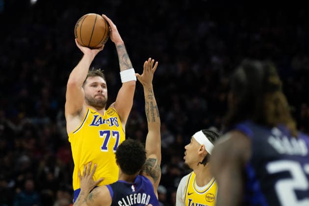 January 12, 2026, Sacramento, Ca, USA: Los Angeles Lakers guard Luka Doncic (77) shoots over Sacramento Kings guard Nique Clifford (5) in the second half during a game at the Golden 1 Center on Monday, Jan. 12, 2026 in Sacramento. Sacramento USA - ZUMAj89_ 20260112_zaf_j89_001 Copyright: xPaulxKitagakixJr.x