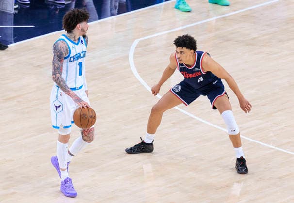 January 12, 2026, Inglewood, California, USA: LaMelo Ball 1 of the Charlotte Hornets looks to get past Kobe Sanders 4 of the Los Angeles Clippers in a 2025 NBA, Basketball Herren, USA regular season game on Monday January 12, 2026 at Intuit Dome Arena in Inglewood, California. JAVIER ROJAS PI Inglewood USA - ZUMAp124 20260112_zaa_p124_077 Copyright: xJavierxRojasx