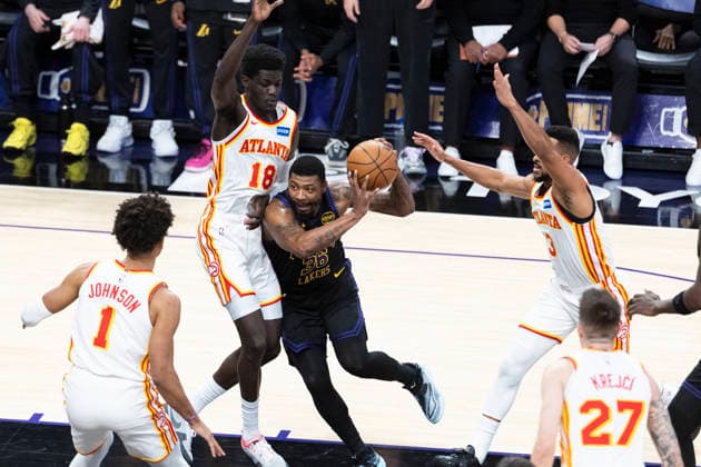 January 13, 2026, Los Angeles, California, United States: Los Angeles Lakersâ„¢ Marcus Smart (36) drives against Atlanta Hawks Mouhamed Gueye (18) during an NBA, Basketball Herren, USA basketball game at Crypto.com Arena on Tuesday, Jan. 13, 2026 in Los Angeles. Los Angeles United States - ZUMAs197 20260113_aaa_s197_485 Copyright: xRingoxChiux
