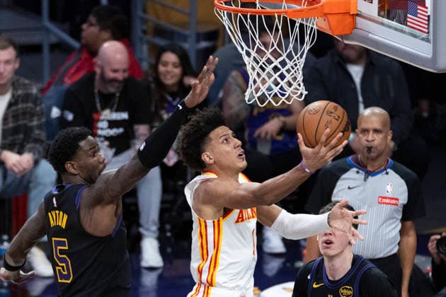 January 13, 2026, Los Angeles, California, United States: Atlanta Hawks Jalen Johnson (1) goes past Los Angeles Lakersâ„¢ Deandre Ayton (5) to the basket during an NBA, Basketball Herren, USA basketball game at Crypto.com Arena on Tuesday, Jan. 13, 2026 in Los Angeles. Los Angeles United States - ZUMAs197 20260113_aaa_s197_493 Copyright: xRingoxChiux