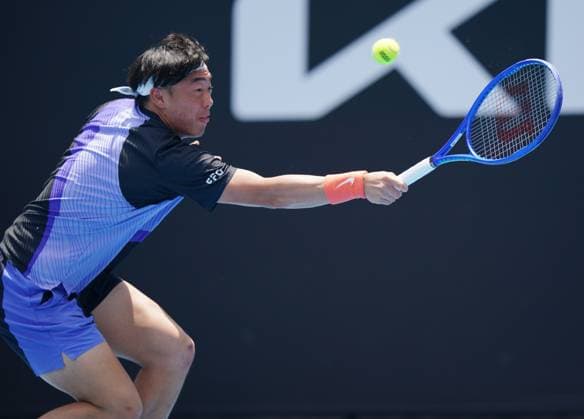 (260114) -- MELBOURNE, Jan. 14, 2026 -- Coleman Wong of China s Hong Kong hits a return during the men s singles qualifying 2nd round match against Pablo Llamas Ruiz of Spain at Australian Open tennis tournament in Melbourne, Australia, Jan. 14, 2026. (Photo by Xinhua) (SP)AUSTRALIA-MELBOURNE-TENNIS-AUSTRALIAN OPEN-MEN S SINGLES-QUALIFYING WangxShen 