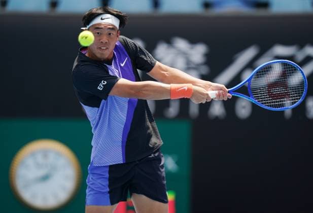 (260114) -- MELBOURNE, Jan. 14, 2026 -- Coleman Wong of China s Hong Kong hits a return during the men s singles qualifying 2nd round match against Pablo Llamas Ruiz of Spain at Australian Open tennis tournament in Melbourne, Australia, Jan. 14, 2026. (Photo by Xinhua) (SP)AUSTRALIA-MELBOURNE-TENNIS-AUSTRALIAN OPEN-MEN S SINGLES-QUALIFYING WangxShen 