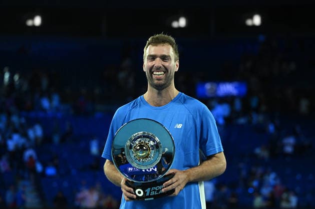TENNIS AO 1 POINT SLAM, Jordan Smith of New South Wales reacts while holding the trophy after defeating Joanna Garland of Taiwan to win the 1 Point Slam event during the Australian Open Opening Week at Rod Laver Arena in Melbourne, Victoria, Wednesday, January 14, 2026. ( NO ARCHIVING, EDITORIAL USE ONLY Melbourne Victoria Australia  Copyright: xJamesxRossx 20260114199530266280