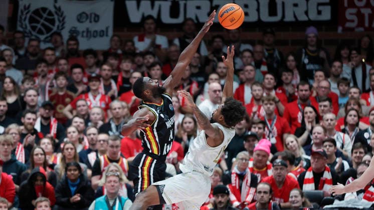 In the picture from left Eddy Edigin Wuerzburg Baskets, 27 against Rickey McGill Patrioti Levice, 0 14 01 2026, Fitness First Wuerzburg Baskets vs Patrioti Levice, Basketball Champions League, Play Ins, Game 3, Germany, 97072, tectake Arena Wuerzburg, Copyright: HMBxMedia xJulienxBecker