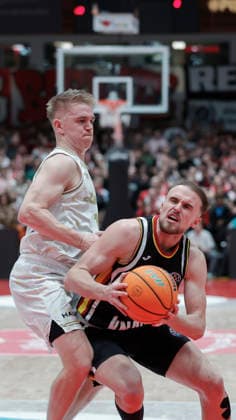 In the picture from left Aatu Kivimaki Patrioti Levice, 12 against Lukas Herzog Wuerzburg Baskets, 1 14 01 2026, Fitness First Wuerzburg Baskets vs Patrioti Levice, Basketball Champions League, Play Ins, Game 3, Germany, 97072, tectake Arena Wuerzburg, Copyright: HMBxMedia xJulienxBecker
