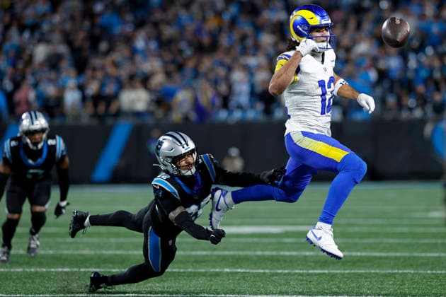 CHARLOTTE, NC - JANUARY 10: Carolina Panthers safety Lathan Ransom (22) defends a pass against Los Angeles Rams wide receiver Puka Nacua (12) during the NFC Wildcard playoff game on January 10, 2026 at Bank of America Stadium in Charlotte, North Carolina. (Photo by Joe Robbins Icon Sportswire) NFL, American Football Herren, USA JAN 10 NFC Wildcard Rams at Panthers EDITORIAL USE ONLY Icon573260110094
