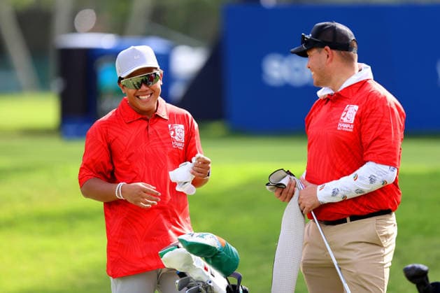 January 14, 2026 - University of Hawaii Rainbow Warrior Football Quarterback Micah Alejado shares a laugh with his caddie and Head Coach Timmy Chang during a Pro-Am prior to the 2026 Sony Open in Hawaii at Waialae Country Club in Honolulu, HI - CSM Honolulu USA - ZUMAc04_ 20260114_zma_c04_150 Copyright: xAndrewxLeex