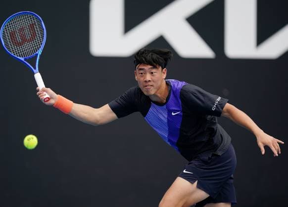 (260115) -- MELBOURNE, Jan. 15, 2026 -- Coleman Wong of China s Hong Kong hits a return during the men s singles qualifying final round match against Elias Ymer of Sweden at Australian Open tennis tournament in Melbourne, Australia, Jan. 15, 2026. (Photo by Xinhua) (SP)AUSTRALIA-MELBOURNE-TENNIS-AUSTRALIAN OPEN-MEN S SINGLES-QUALIFYING WangxShen 