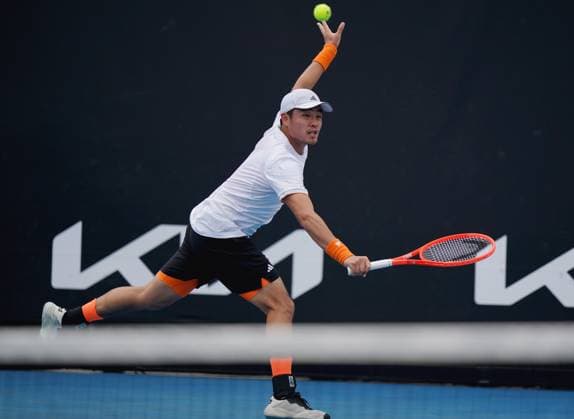 (260115) -- MELBOURNE, Jan. 15, 2026 -- Wu Yibing of China hits a return during the men s singles qualifying final round match against Tristan Boyer of the United States at Australian Open tennis tournament in Melbourne, Australia, Jan. 15, 2026. (Photo by Xinhua) (SP)AUSTRALIA-MELBOURNE-TENNIS-AUSTRALIAN OPEN-MEN S SINGLES-QUALIFYING WangxShen 