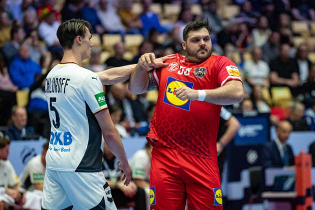 HERNING, DENMARK - JANUARY 15: Miro Schluroff (Germany, 05) against Tobias Wagner (Austria, 55) during the EHF EURO 2026 match between Germany vs Austria at Jyske Bank Boxen Arena on matchday 1 of the Group Matches Group A on January 15, 2026 in Herning, Denmark. Midtjylland Denmark Copyright: xMarioxM.xKobergx