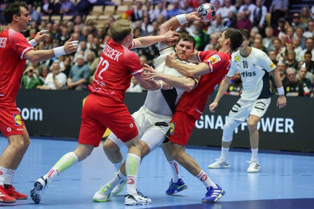 Germany Austria, EHF EM 2026 Johannes Golla Germany, 4 is stopped at the circle by Lukas Hutecek Austria, 72 and Boris Zivkovic Austria, 30 Handball EHF European Championship, international match between Germany and Austria on January 15, 2026 in Herning Denmark , Herning Denmark Jyske Bank Boxing