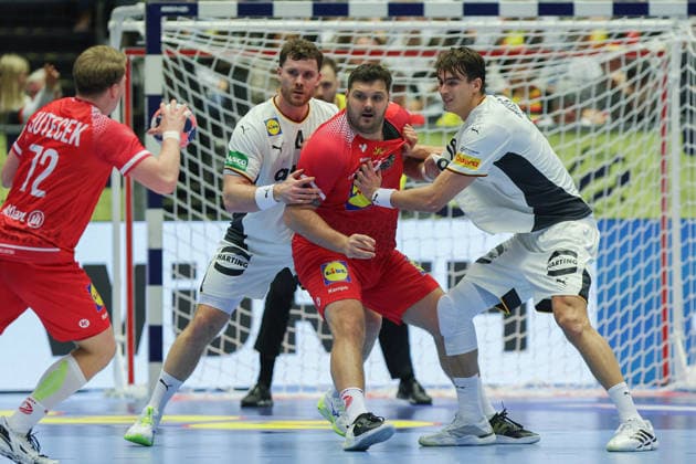 Germany Austria, EHF EM 2026 Tobias Wagner Austria, 55 is neutralized by Johannes Golla Germany, 4 and Julian Köster Germany, 18 Left Lukas Hutecek Austria, 72 Handball EHF European Championship, international match between Germany and Austria on 15 January 2026 in Herning Denmark , Herning Denmark Jyske Bank Boxen